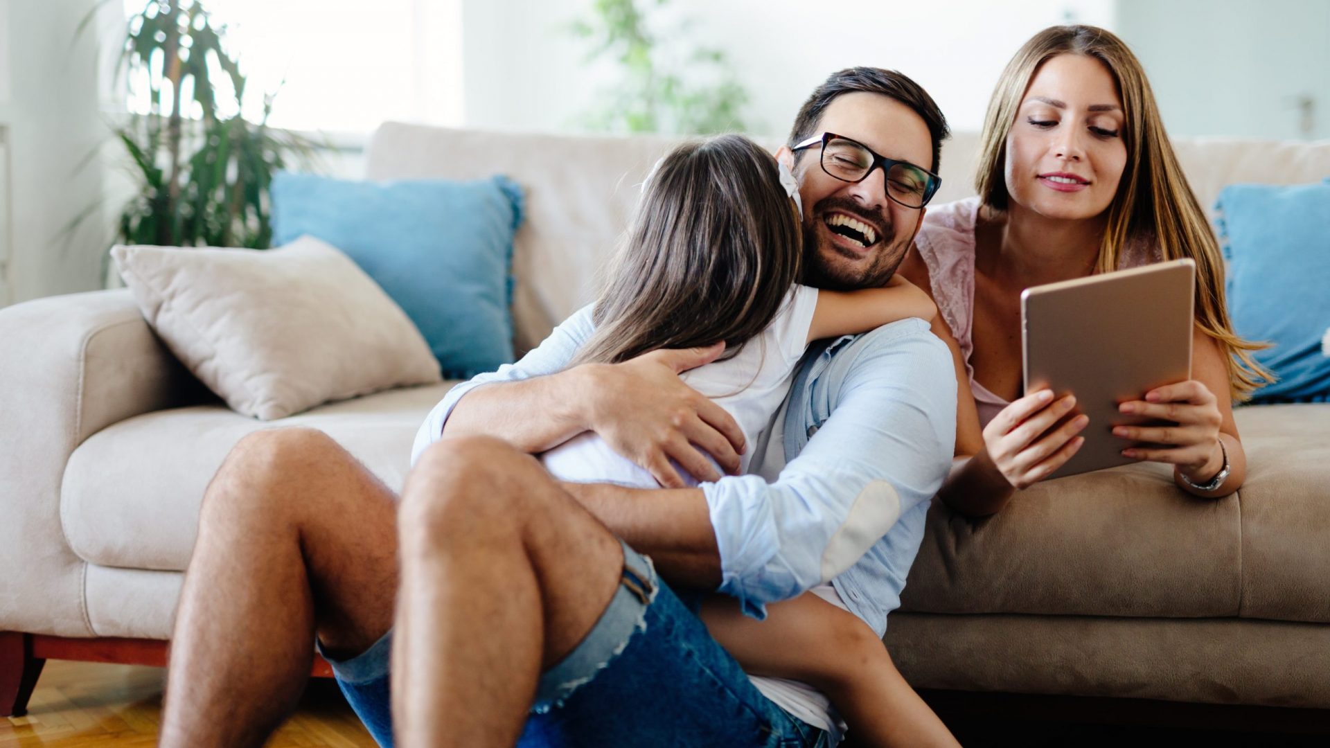 family at home on the sofa