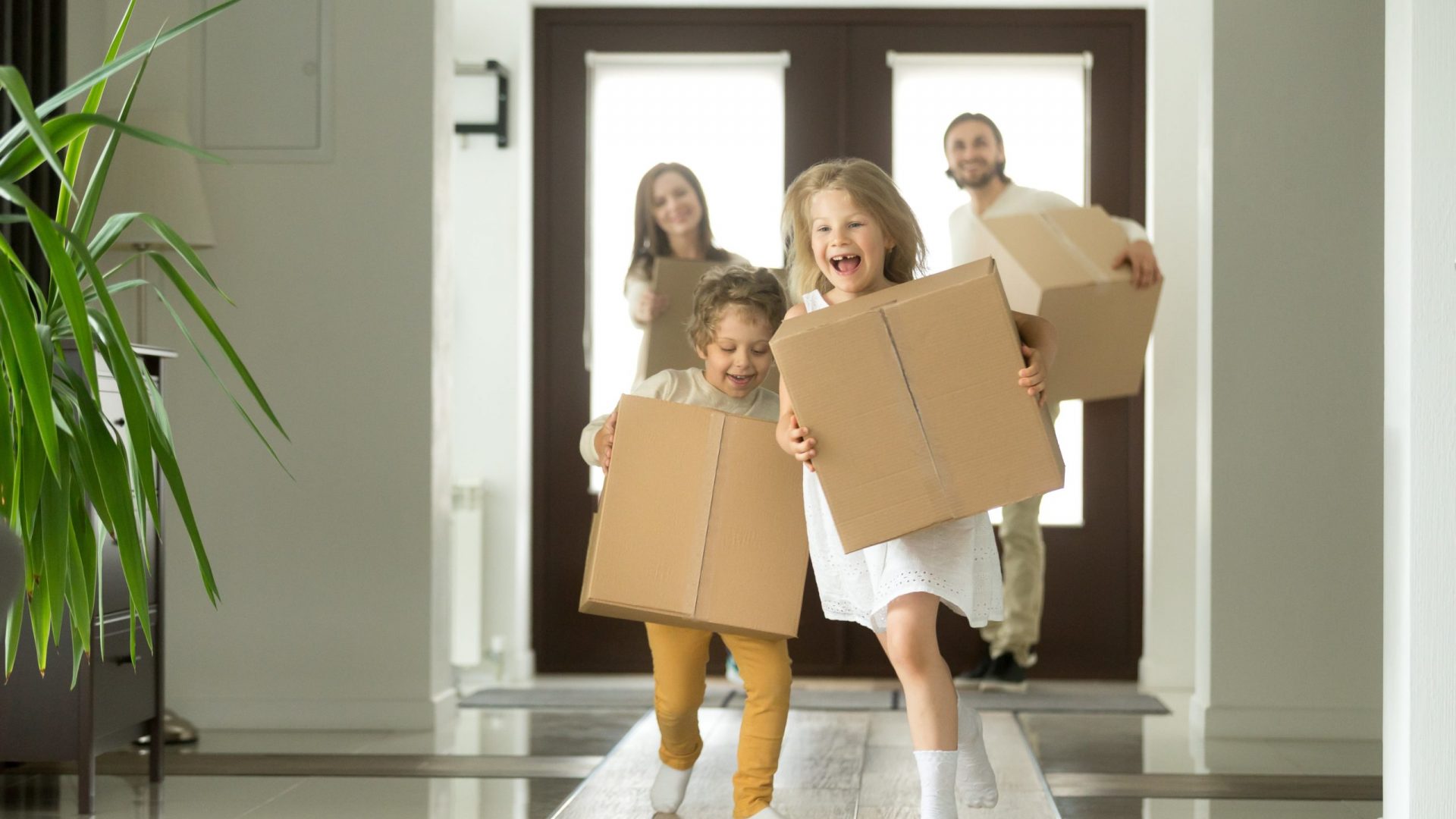 kids running while moving boxes