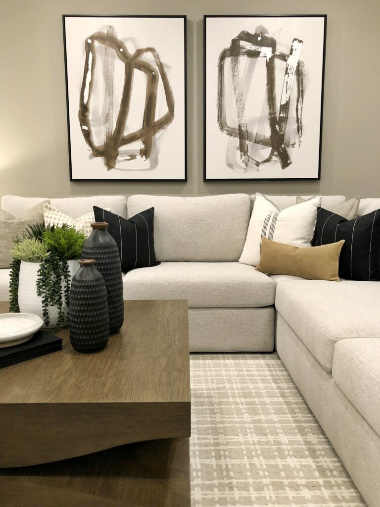 redefined monochromatic neutral living room with modern art