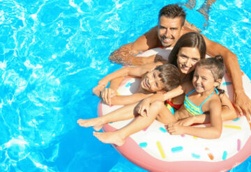 family enjoying the pool