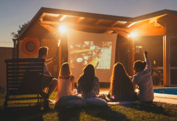 family outside in the backyard summer movie night