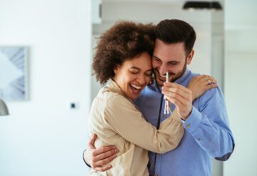 happy couple buying a home