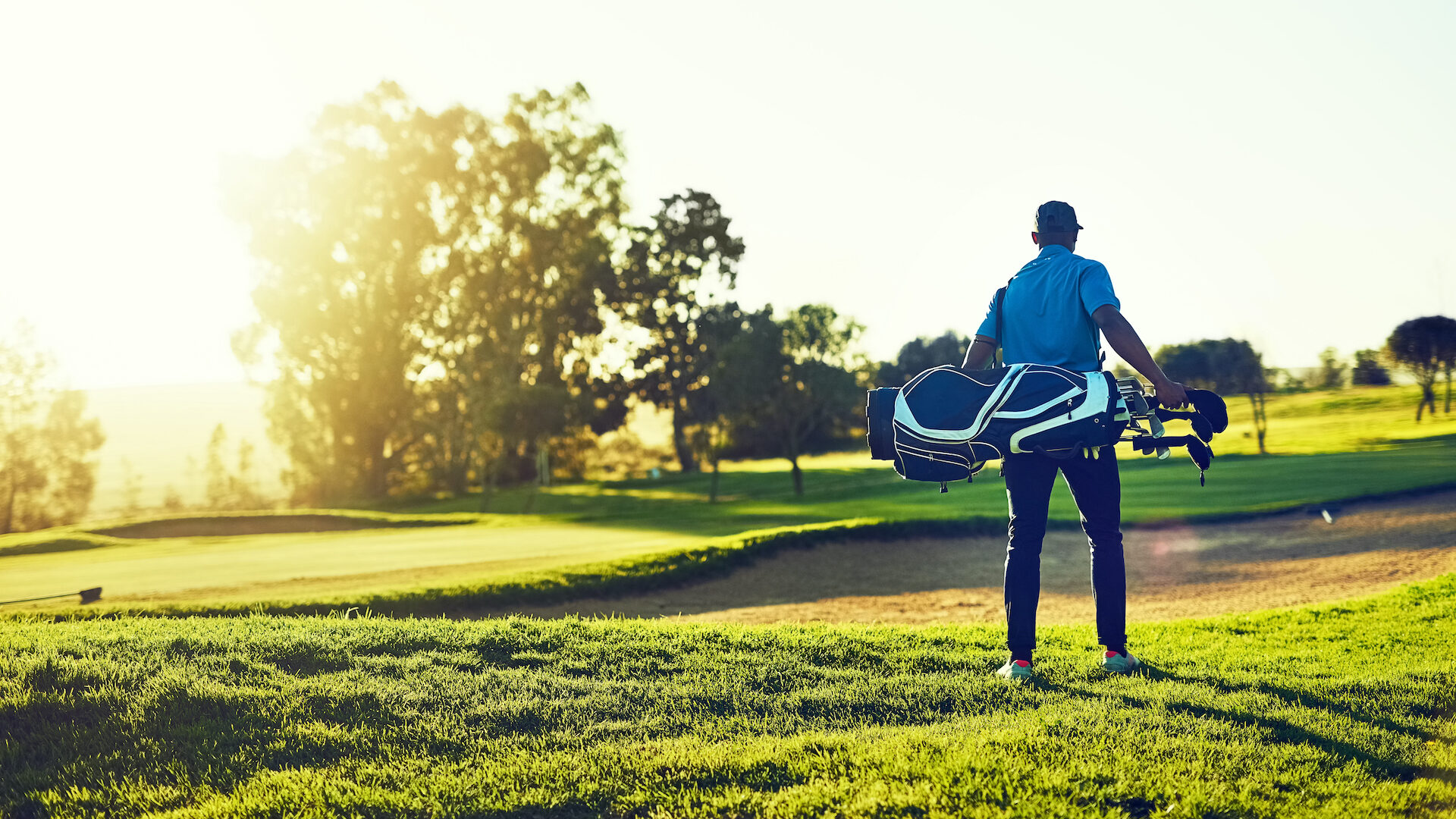 Stock photo of man on golf course