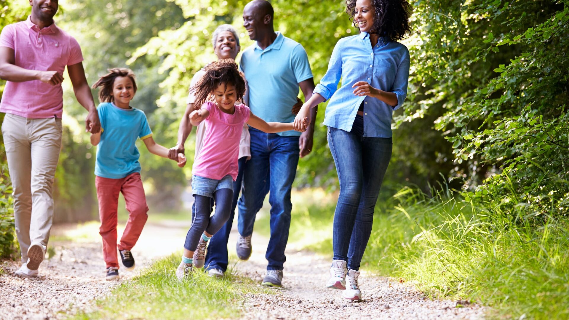 Stock photo of a family outdoors enjoying a nature walk
