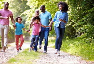 Stock photo of a family outdoors enjoying a nature walk