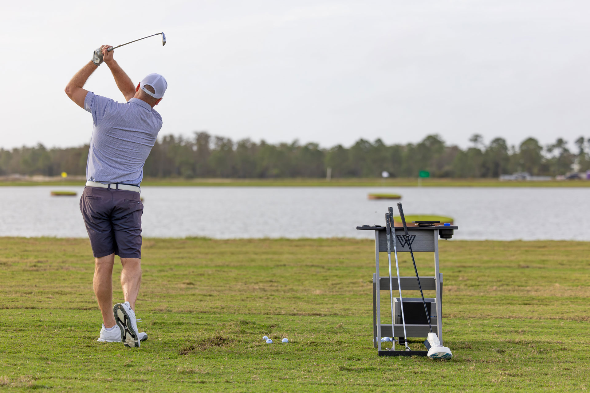 Webbs Reserve Golf opening player swinging club