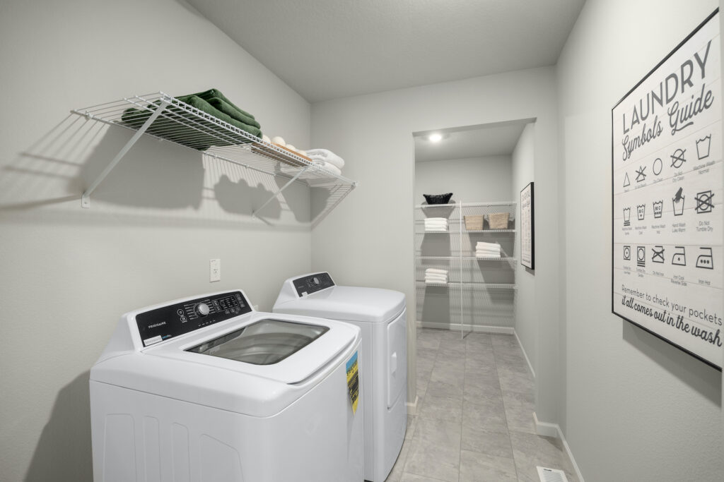 Kaplan model home showcasing the included washer and dryer in the laundry room