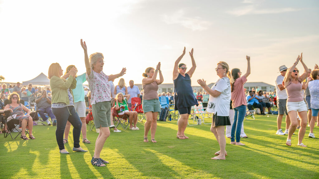 people dancing outside at concert