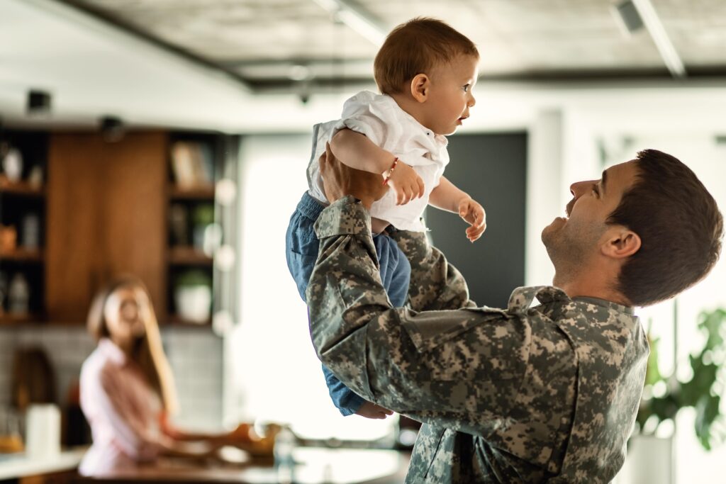 Military Man Holding Baby