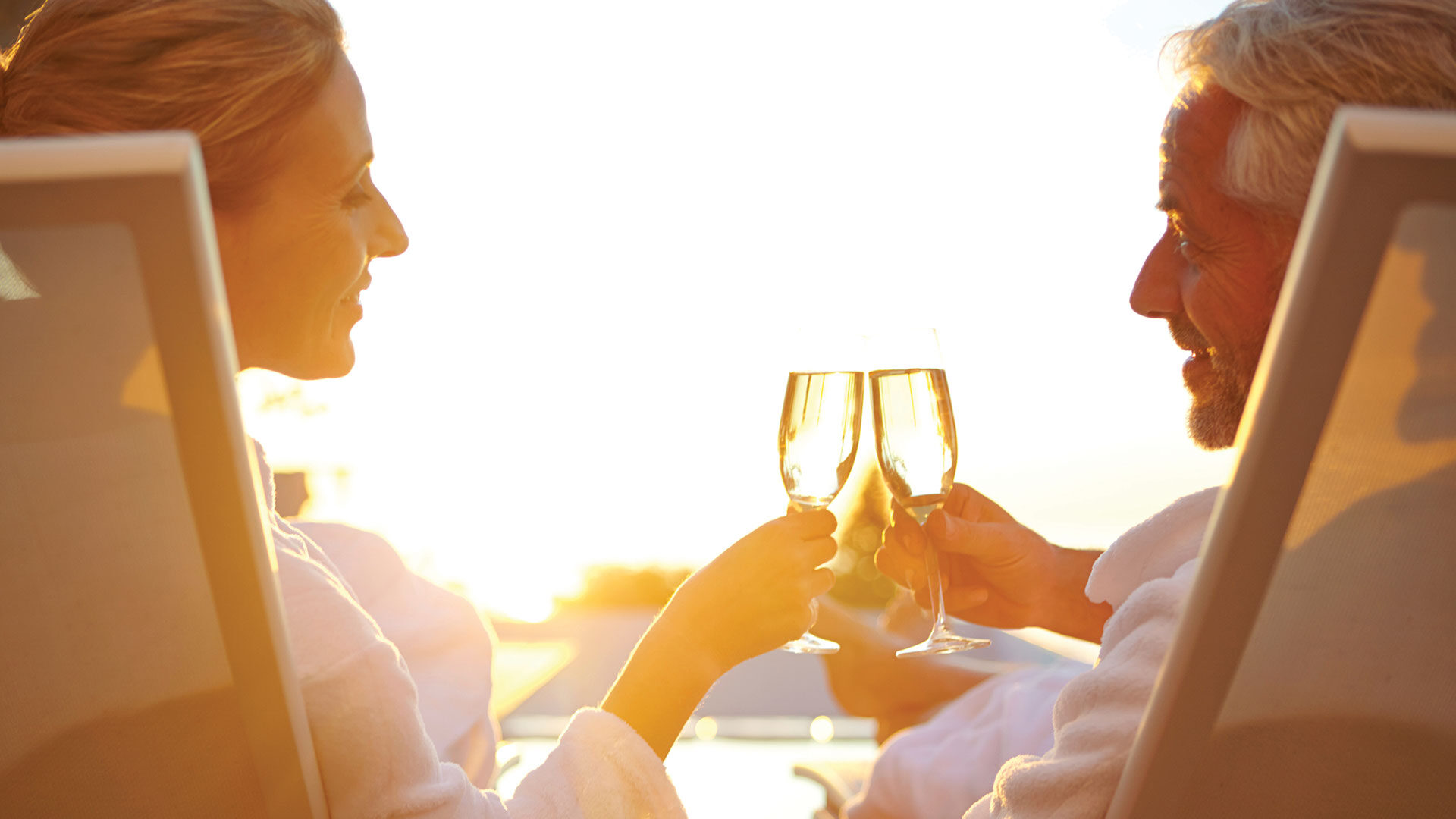 Active Adult Couple Outdoors Cheers