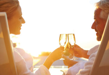Active Adult Couple Outdoors Cheers