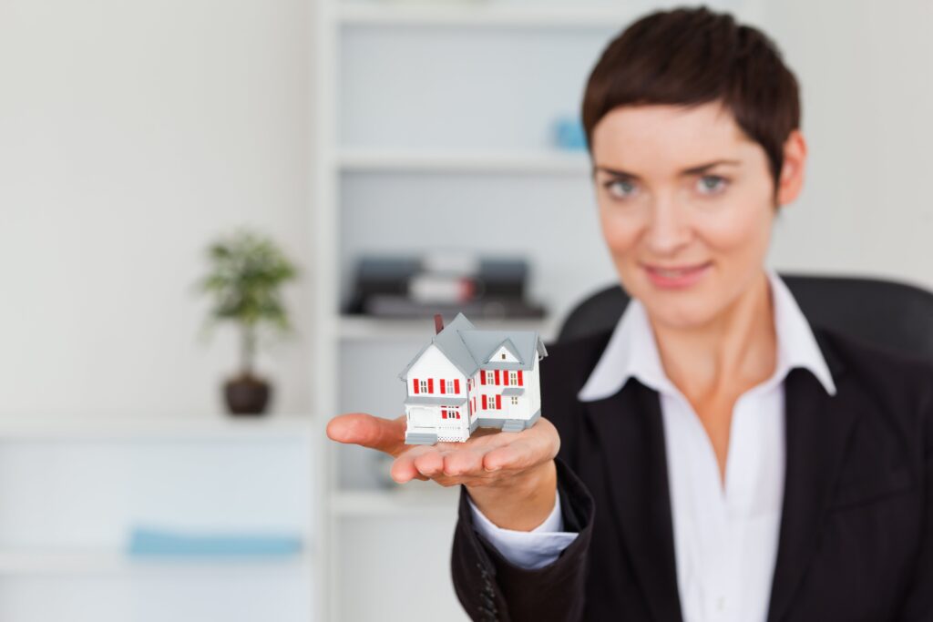Broker Realtor Woman Holding House