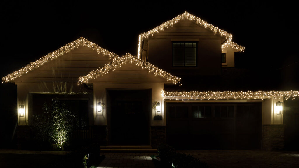 Holiday lights around the house exterior and roof