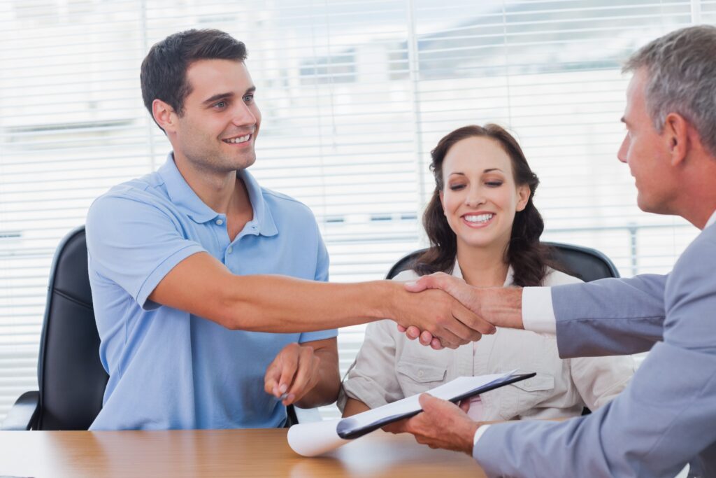 a couple buying a home closing day